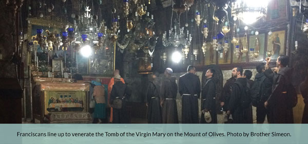 Franciscans lining up to venerate the Virgin Marys Tomb in Jerusalem