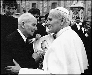 Pope John Paul II with the man whose place Saint Maximilian took